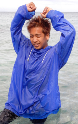 Lifeguard signals both hands up danger